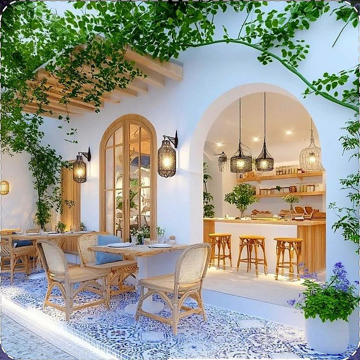 Cafe coastal dengan dominasi warna biru-putih dan material rotan alami